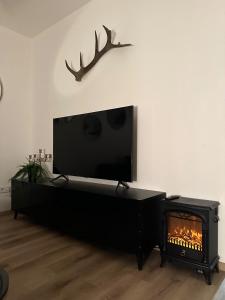 TV o dispositivi per l'intrattenimento presso Apartmány Čerňák - Dolňák - 4-6 osob, terasa, grill, dvě parkovací místa