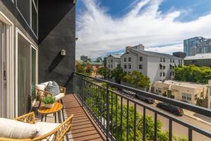 a balcony with a view of a city at The Italian Retreat, Little Italy in San Diego