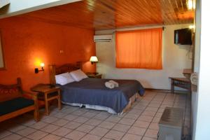 Postel nebo postele na pokoji v ubytování Villa Santa Cruz Creel