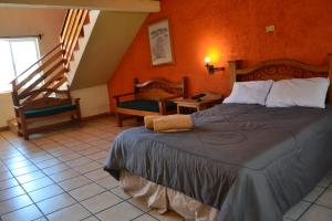 Postel nebo postele na pokoji v ubytování Villa Santa Cruz Creel