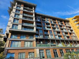 an apartment building with balconies on the side of it at PERFECT RESİDENCE TAKSİM, 2 BEDROOM, POOL, Gym, Sauna in Istanbul