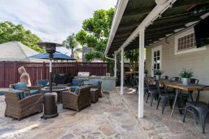 an outdoor patio with tables and chairs and a grill at 4221 Urban oasis in Hillcrest Mission Hills in San Diego