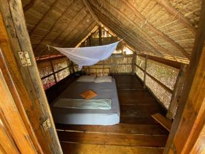 Postel nebo postele na pokoji v ubytování Robinson Bungalows