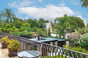 a balcony with a view of a house at Sierra Blanca Resort and Spa in Marbella