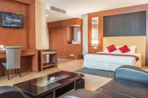 Postel nebo postele na pokoji v ubytování Hotel Pen Mutiara