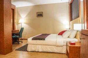 Postel nebo postele na pokoji v ubytování Hotel Pen Mutiara