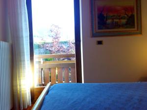 Postel nebo postele na pokoji v ubytování B&B Casa Bazzanella