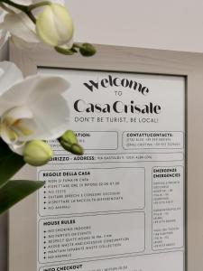 a sign that says welcome to caesar casserole at Casa Crisale in Alba