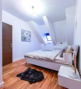 a bedroom with a bed in a attic at Bucharest Central D Apartment in Bucharest