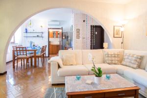 a living room with a couch and a table at Apartment with private pool and arbor in Malinska +36 photos