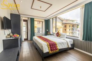 Postel nebo postele na pokoji v ubytování Swan Sapa Hotel