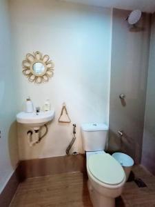 a bathroom with a toilet and a sink at 6 - Affordable 2-Storey House in Cabanatuan City in Cabanatuan