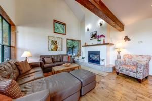 a living room with a couch and a fireplace at Northern Lights 21 in Whistler