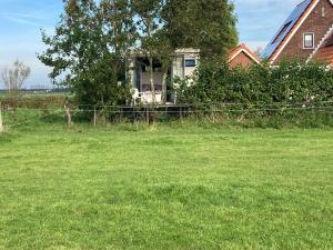 Zahrada ubytování Het oude strandhuis + 5 fotografií