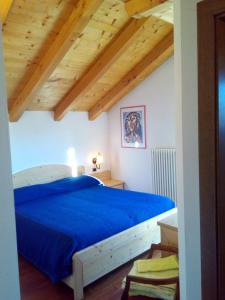 Postel nebo postele na pokoji v ubytování B&B Casa Bazzanella