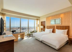 Postel nebo postele na pokoji v ubytování Mövenpick Hotel Al Khobar