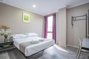 Postel nebo postele na pokoji v ubytování HOTEL 28 RAPID