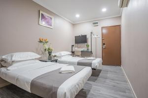 Postel nebo postele na pokoji v ubytování HOTEL 28 RAPID