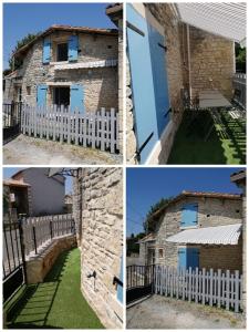 una casa de ladrillo con puertas azules y una valla blanca en Gîte Bin Benaise linge compris, en Pamproux