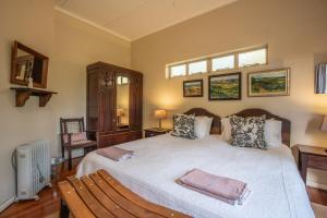 Postel nebo postele na pokoji v ubytování Tygerfontein Safari Villa