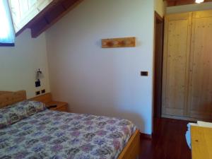 Postel nebo postele na pokoji v ubytování B&B Casa Bazzanella