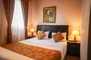 Postel nebo postele na pokoji v ubytování Eskibağ Butik Hotel