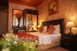 Postel nebo postele na pokoji v ubytování Eskibağ Butik Hotel