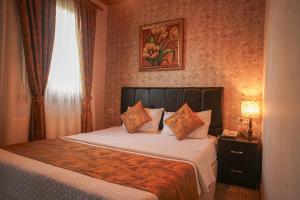 Postel nebo postele na pokoji v ubytování Eskibağ Butik Hotel