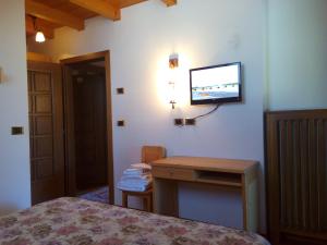 Postel nebo postele na pokoji v ubytování B&B Casa Bazzanella