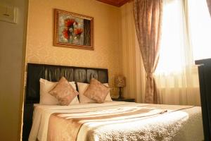 Postel nebo postele na pokoji v ubytování Eskibağ Butik Hotel