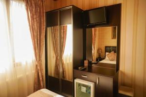 Postel nebo postele na pokoji v ubytování Eskibağ Butik Hotel