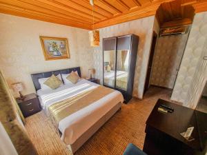 Postel nebo postele na pokoji v ubytování Eskibağ Butik Hotel