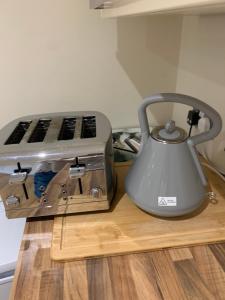 a tea kettle sitting on a counter next to a toaster at Guest suite Annex private room in Saint Ives