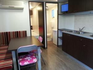 A kitchen or kitchenette at Villaggio Camping Europa