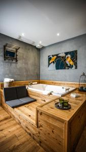 a large wooden bath tub in a room at Drì bed & breakfast in Rocca di Papa