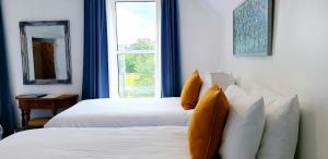 Ένα ή περισσότερα κρεβάτια σε δωμάτιο στο The Osprey Hotel +19 φωτογραφίες