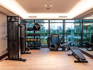 a fitness room with a gym with exercise equipment at Prime Retreats @ Address Residence Opera By Emaar in Dubai