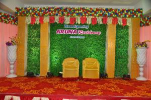 a stage with two chairs and a sign that readsirmina railway at Aruna Residency in Sankarankovil