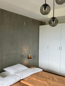 Ліжко або ліжка в номері Tikka Apartments