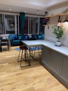 a kitchen and living room with a table and a couch at Central Sheffield 3BED 3BATH V Pent-Apartment in Sheffield