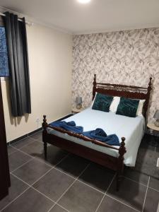 Quinta' Home tesisinde bir odada yatak veya yataklar