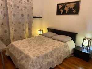 Een bed of bedden in een kamer bij Bel appartement de 72m, situé près de Lyon avec parking gratuit