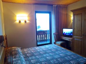 Postel nebo postele na pokoji v ubytování B&B Casa Bazzanella