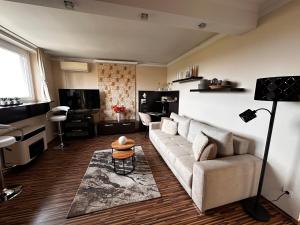 a living room with a couch and a table at Apartment on Gellért Hill Downtown with free garage & Castle View in Budapest