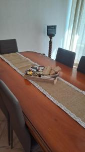 a long wooden table with at La casa nel borgo in Bracciano