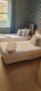 Postel nebo postele na pokoji v ubytování Hotel Central Anzac