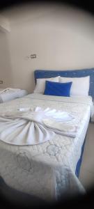 Postel nebo postele na pokoji v ubytování kılıç otel