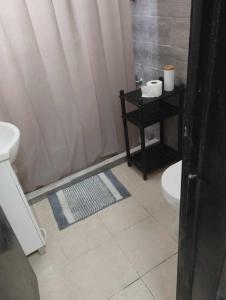 a bathroom with a shower with a toilet and a sink at Cantinho do Sol in Grândola