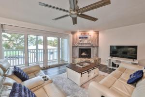a living room with a couch and a fireplace at 100 steps to beautiful Indian Rocks Beach, oceanside, 2 bedroom updated condo in Clearwater Beach