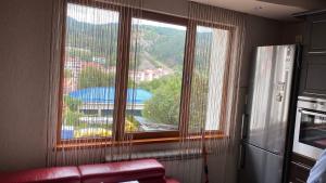 a room with a large window with a view at Eda Aparts in Devin